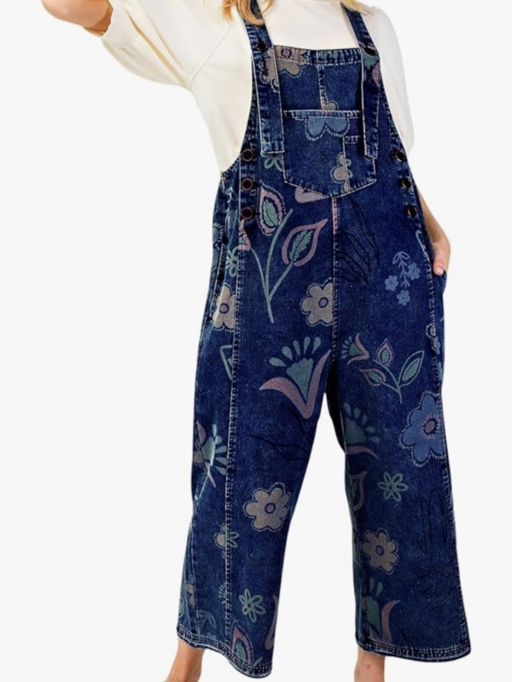 Stylish dark blue denim women's overalls with a subtle floral print. Comfortable